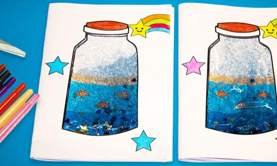 A pair of completed ocean-themed notebooks with colourful jars, glittery blue water, and cheerful rainbow stars on the cover.