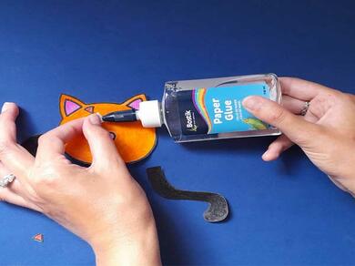 Using Bostik Paper Glue to assemble a colourful animal-themed paper craft