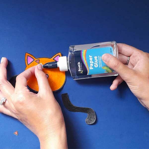 Using Bostik Paper Glue to assemble a colourful animal-themed paper craft