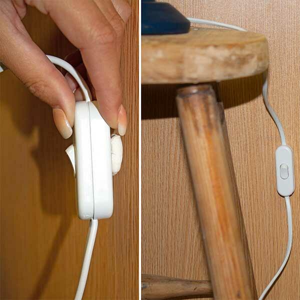 Using Bostik Prestik to fix a light switch to a wooden surface, with a close-up of cable neatly secured