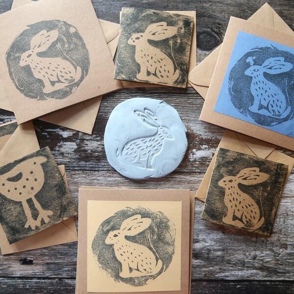Detailed clay impression of a hare stamp showing textured fur and long ears.