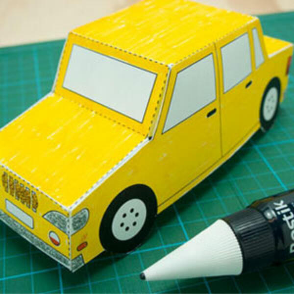Two completed yellow paper cars displayed together, looking like fun DIY toy cars made from craft paper.