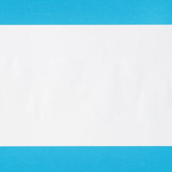 White sheet of paper with faint blue adhesive marks from a Bostik Blu Stik application.