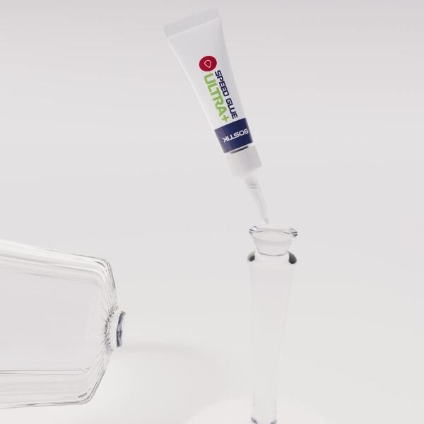 Applying Bostik Super Glue Ultra+ to the stem of a broken crystal wine glass for repair
