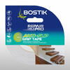 Bostik Anti-Slip Grip Tape in clear, shown in retail packaging with a visible transparent roll and an application image of wooden indoor stairs. The tape measures 5 metres by 48 millimetres and provides discreet slip resistance for smooth surfaces without altering the appearance.